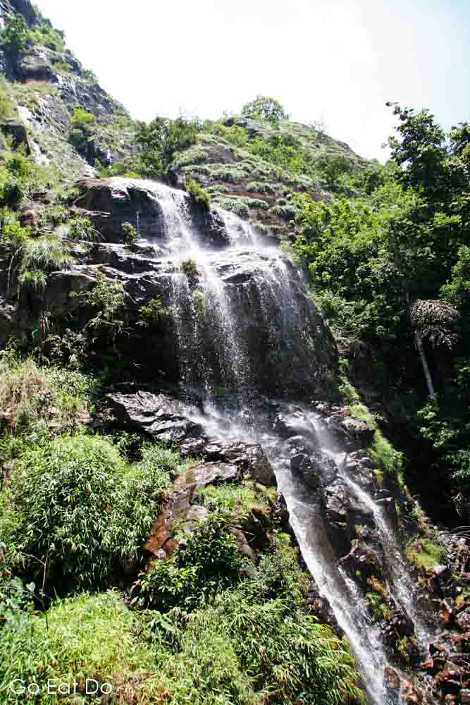 Waterfall tumbles over a rocky outcrop in the Nilgiri Mountains of southern India
