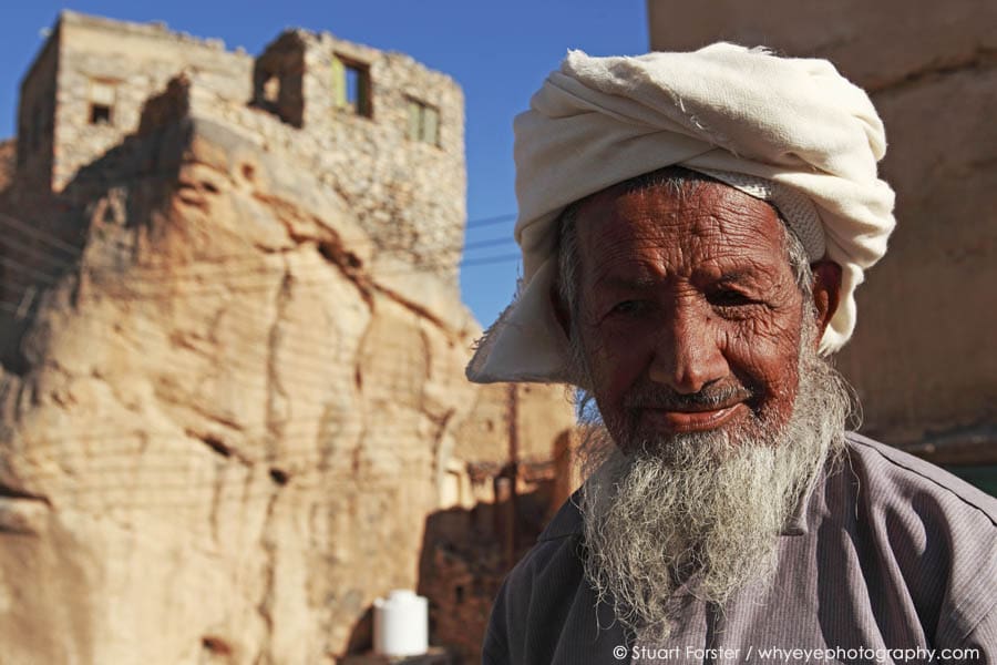 Old Omani man with a wrinked face and traditional mussa headgear in the mountain village of Misfah al Abrayeen, Oman