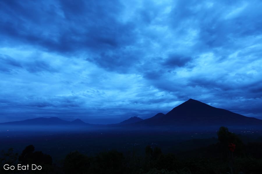 Cloudy landscape of Virunga Mountain Range in the small hours of the morning in the Volcanoes National Park, the location of treks to view mountain gorillas in Rwanda