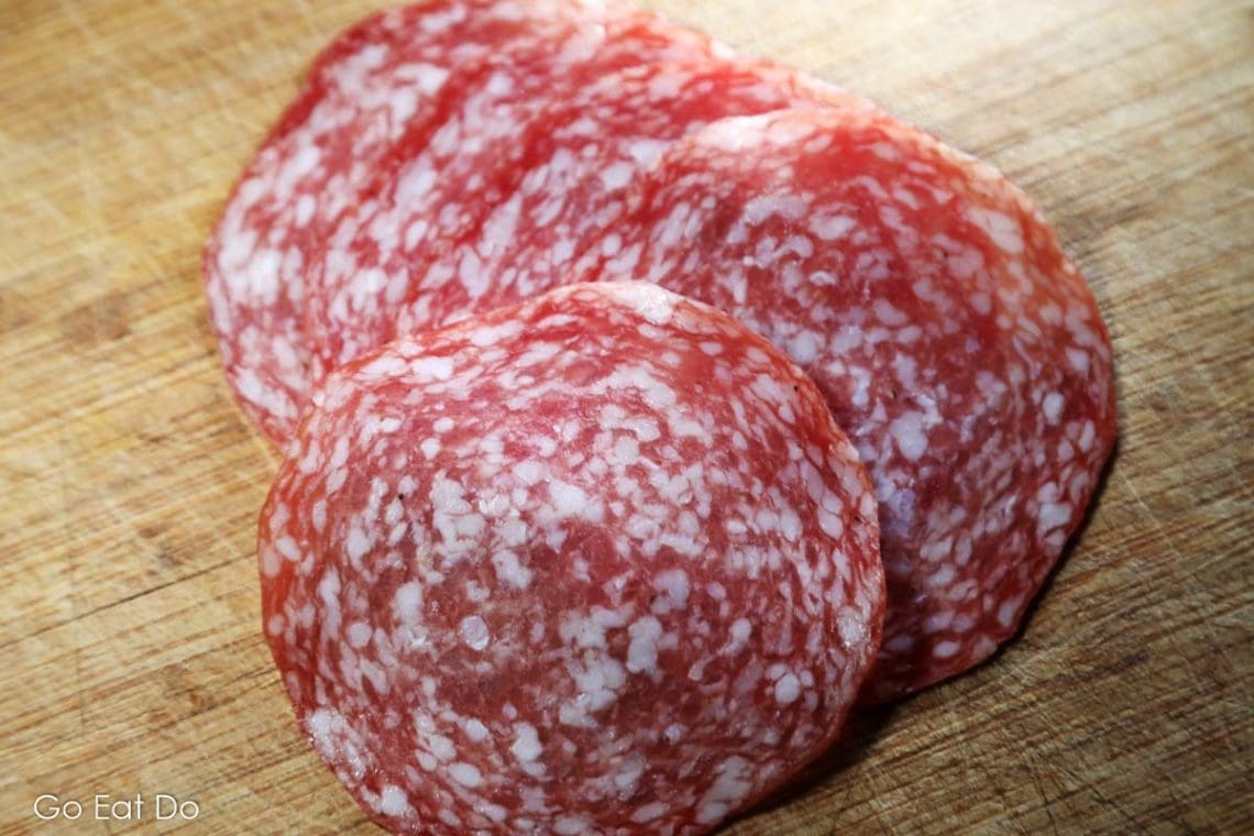 Sliced salami of the type of sausage that could be entered into