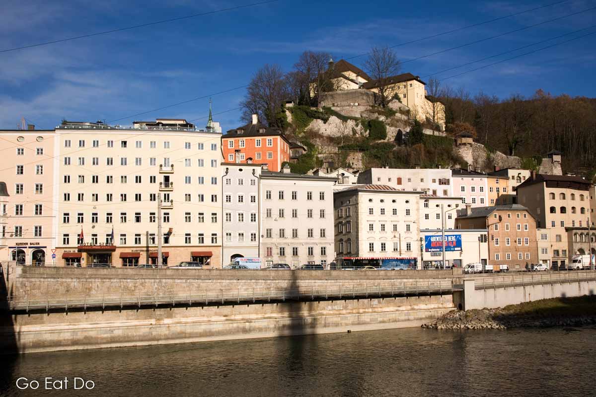 The Kapuzinerberg and buildings in the Neustadt (New Town) district overlooking the River Salzach in Salzburg, Austria.