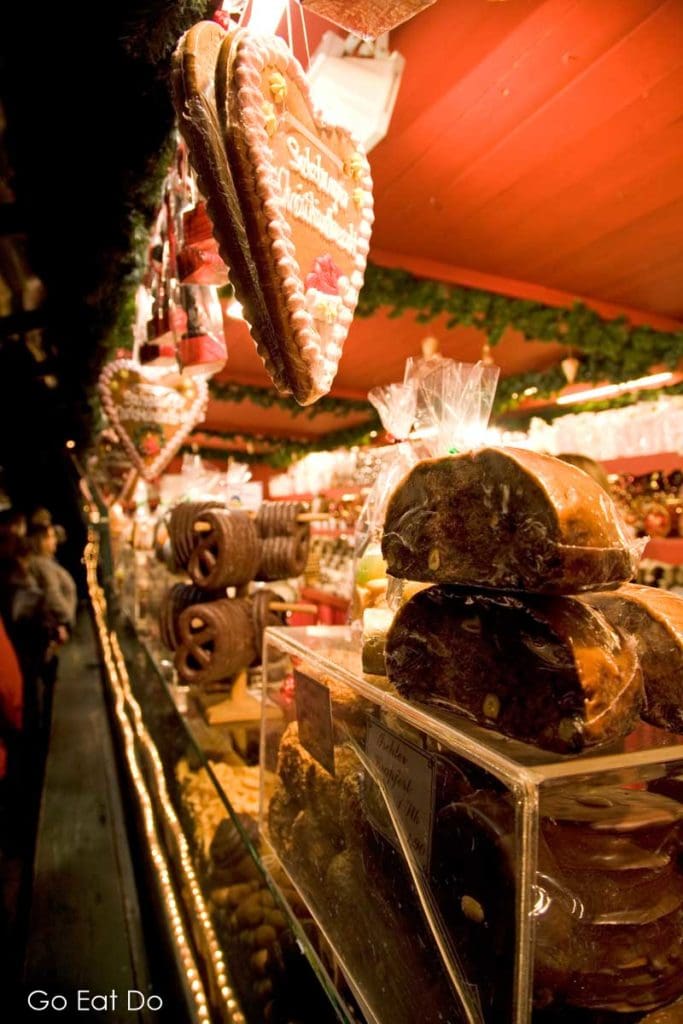 Gingerbread hearts, Stollen and Lebkuchen on sale at a market stall.