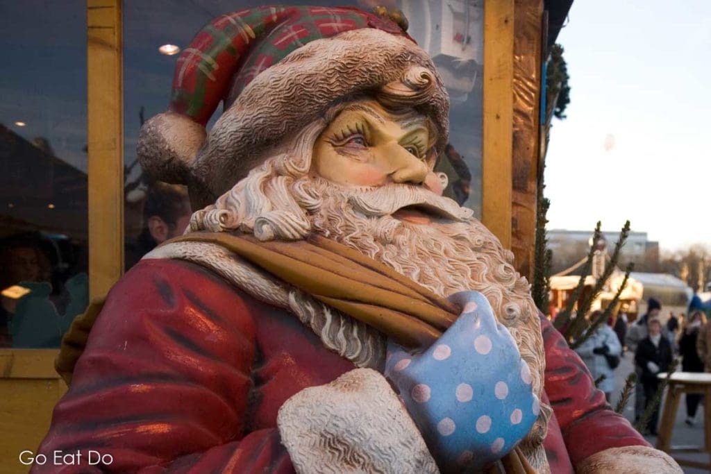 Santa Claus figure at the Tollwood Winter Festival in Munich's alternative Christmas market at the Theresienwiese, the site of the Munich Oktoberfest.