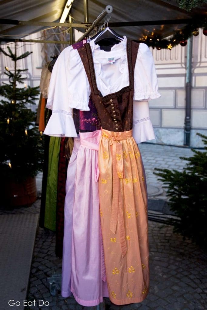 Traditional Dirndl dresses for sale at a Munich Christmas market.