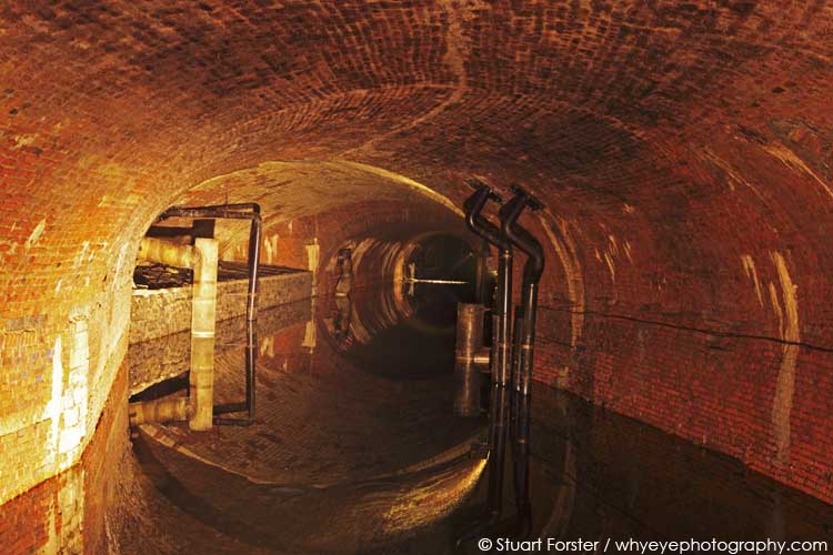 View of an underground waterway in one of the 'ruien,' one of the subterranean canals in Antwerp, Belgium