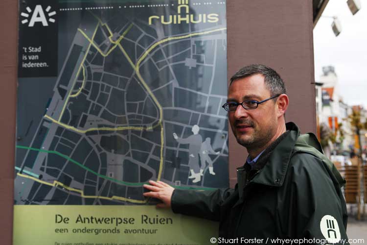 Guide Rick Philips by a map of the 'ruien' the underground canal system in Antwerp, Belgium. Photo by Stuart Forster.