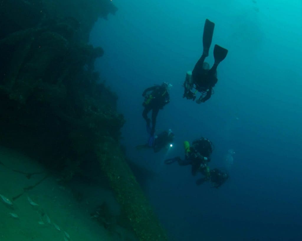 Scuba divers on a Haliotis-led dive in the Atlantic Ocean ...