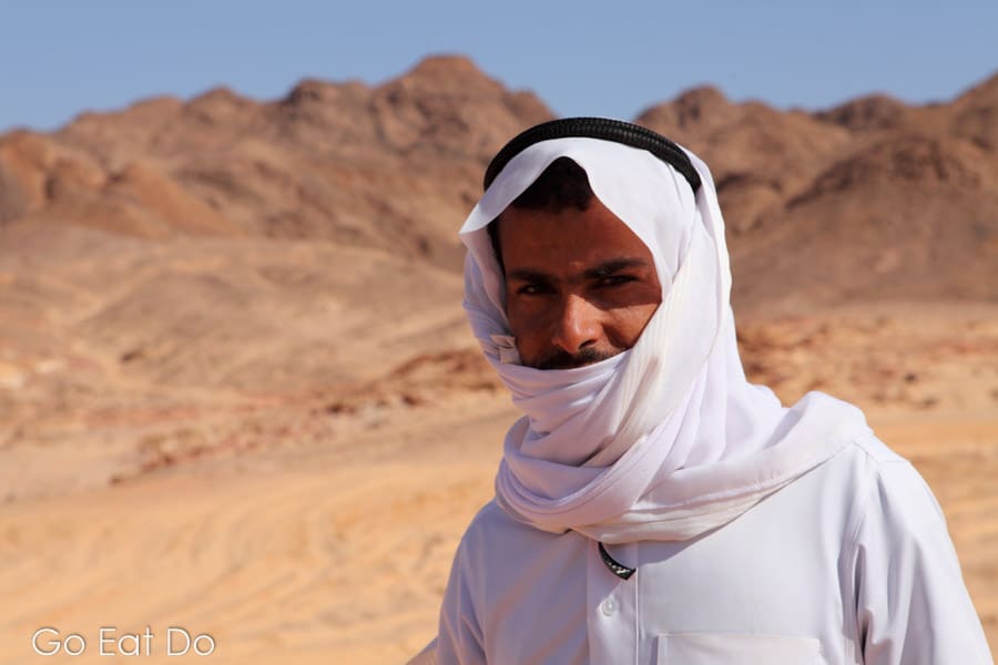 A Bedouin guide in traditional Arabic clothing in the Coloured Canyon in Egypt's Sinai Desert.