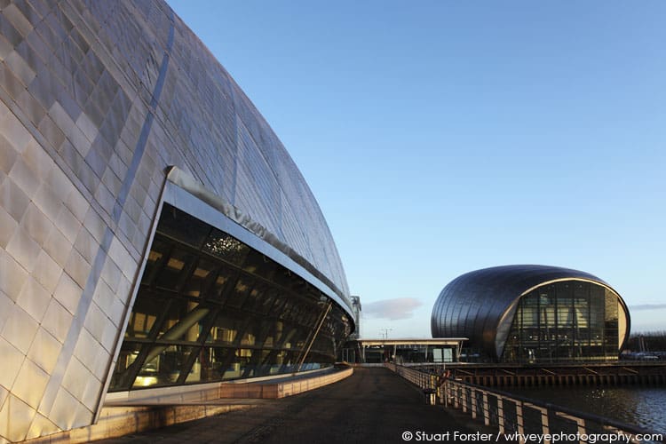 The metallic facade of the Imax Cinema, by the Glasgow Science Centre on a sunny day in Glasgow, Scotland.