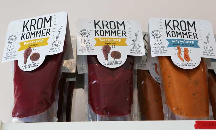 Packs of three soups made from wonky vegetables on a shelf at Kromkommer's head office in Rotterdam, the Netherlands