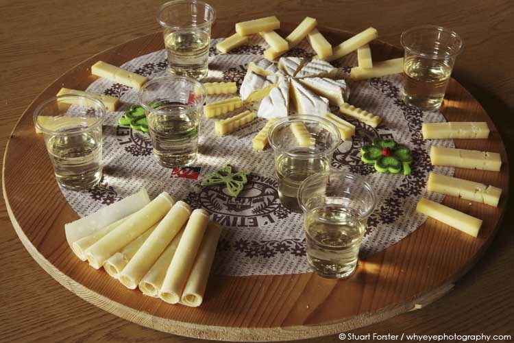 Swiss mountain cheeses and regional white wine at La Maison de L'Etivaz in Etivaz, Switzerland.