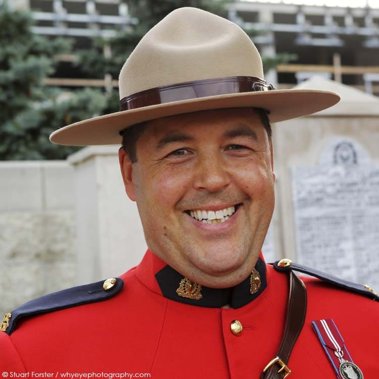 Smiling mountie, a RCMP officer at the Royal Canadian Mounted Police Depot in Regina, Saskatchewan, Canada