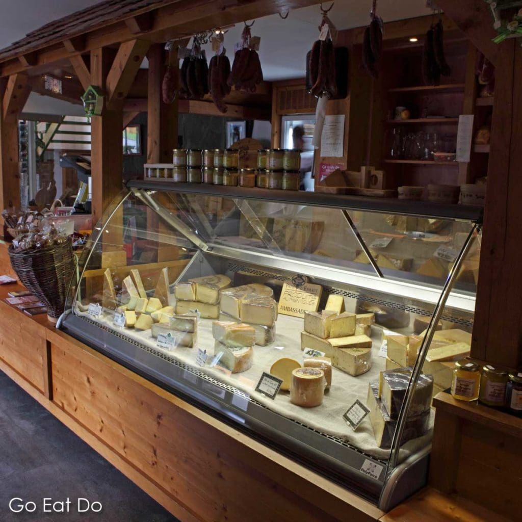Cheese counter at La Maison de L'Etivaz in Etivaz, Switzerland. The shop is part of a co-operative selling cheeses and foodstuffs made in the surrounding mountain region.