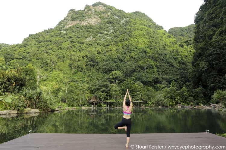 A yoga session by the naturally heated pool at the Banjaran Hotsprings Retreat near Ipoh, Malaysia