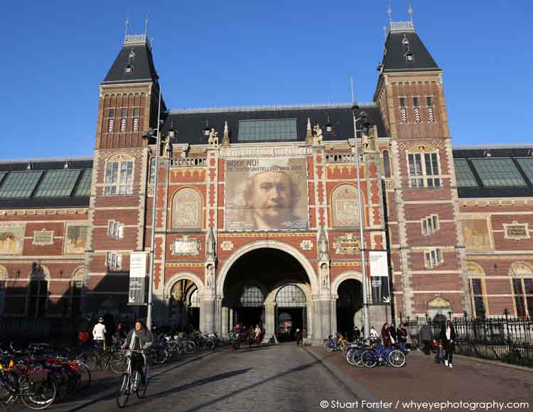 Face of Dutch Golden Age artist Rembrandt van Rijn of the facade of the Rijksmuseum in Amsterdam, the Netherlands