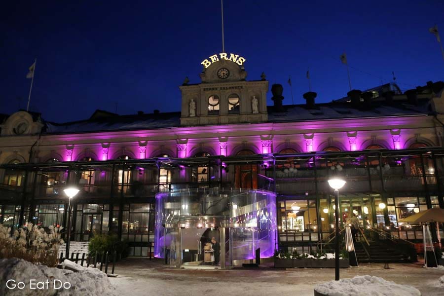 Night view of the exterior of the Berns Hotel, which has a nightclub, chic Asian restaurant and boutique guestrooms in Stockholm, Sweden