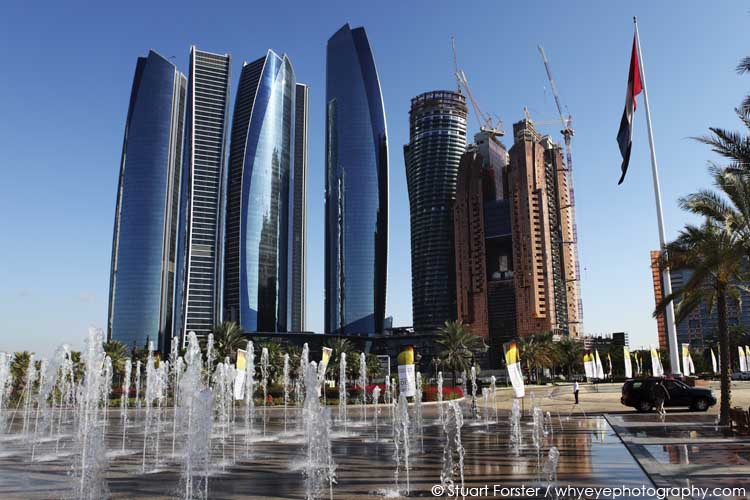 Fountains shoot water an a plaza near the Etihad Towers in Abu Dhabi