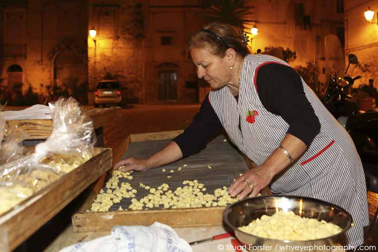 Carmela prepares orecchiette, a pasta shape named after 'little ears', in the Bari Vecchia quarter of Bari, Apulia, Italy