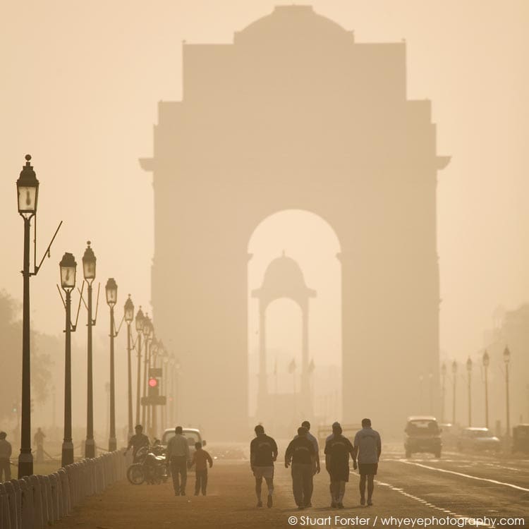 People walking at the India Gate, one the top landmarks in New Delhi, India