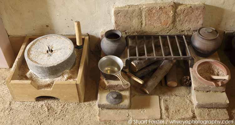 Millstone and stove in a barrack room at Pohl Roman fortlet in Germany