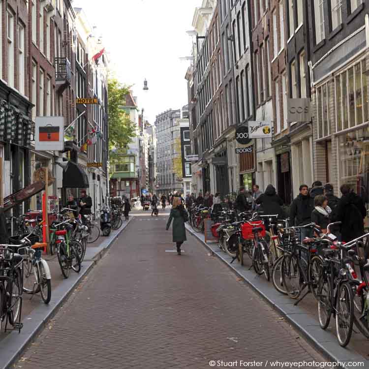 Shoppers and bicycles on Ree Straat in the Negen Straatjes (Nine Streets) in central Amsterdam, the Netherlands.