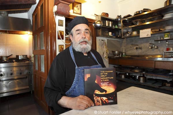 Monk Epifanios of Mylopotamos shows off his recipe book at Mount Athos, Greece