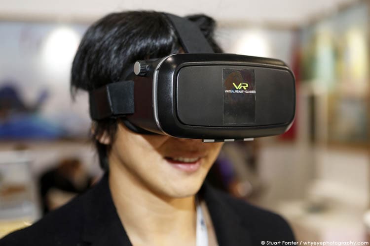 Ivan Chen demonstrates the use of a Virtual Reality headset at the Excel London during the World Travel Market in London, UK.