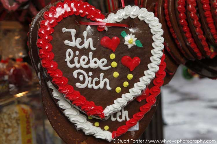 A gingerbread heart reads "Ich liebe Dich" meaning "I love you".