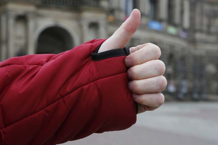 Thumbs up gesture through the thumb loop on the Snugpak SJ6 jacket
