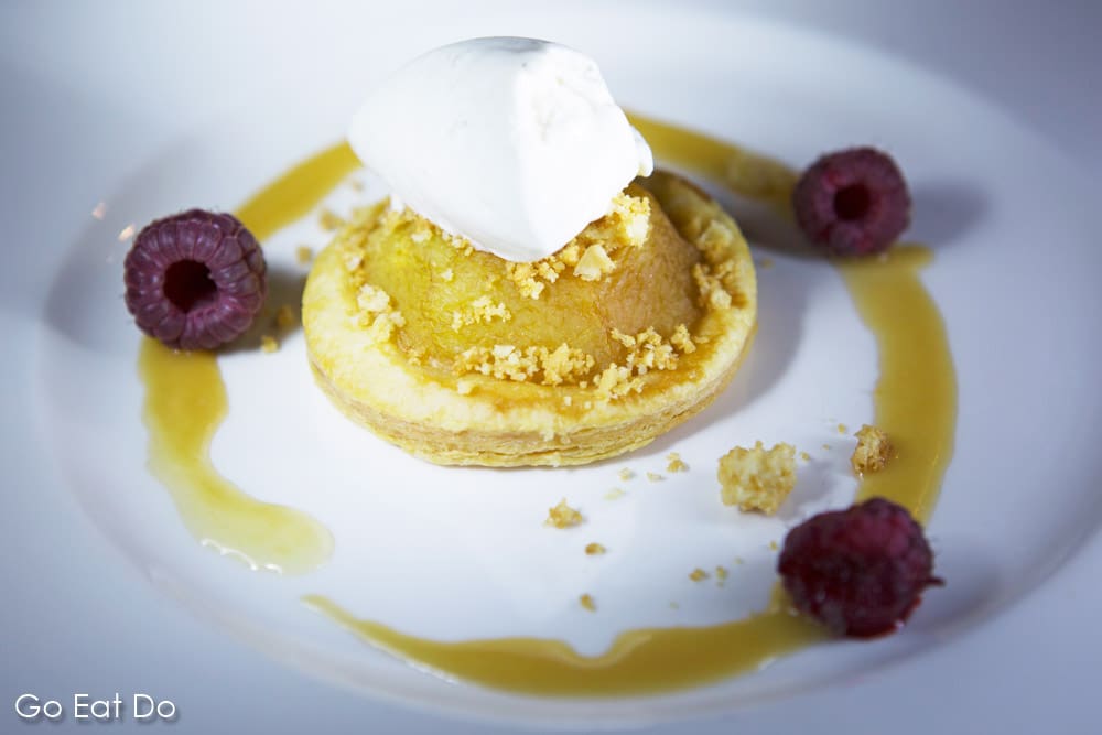 Apple tart served with ice cream and raspberries at a top restaurant in Tenerife
