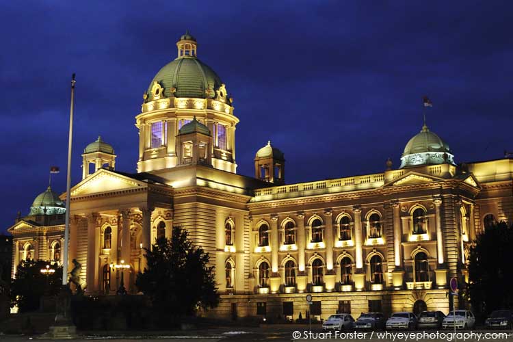 Serbian Parliament building illuminated at night in Belgrade, Serbia.