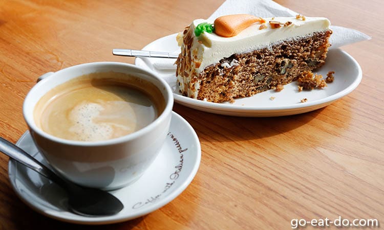 Coffee and a slice of carrot cake served in Edinburgh, Scotland