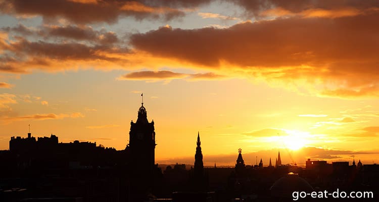 Spires silhouetted by a golden sunset over Auld Reekie, Edinburgh, Scotland