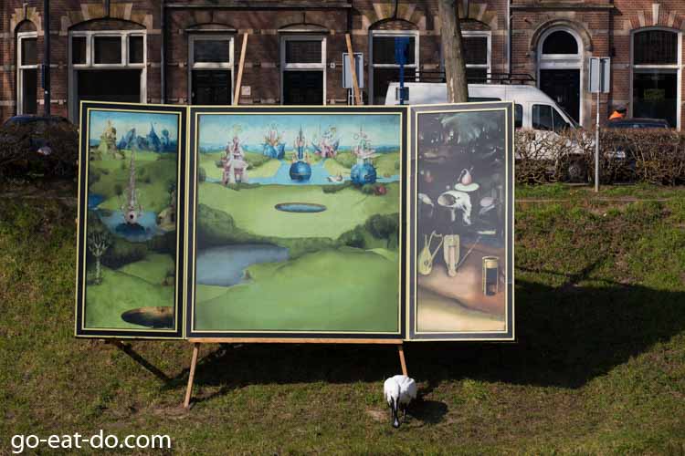 Triptych based on The Garden Of Earthly Delights by Heironymus Bosch by the River Binnendieze in 's-Hertogenbosch.