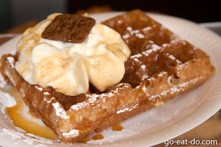 Cream-topped waffle, a much loved Belgian snack, served in Brussels, Belgium