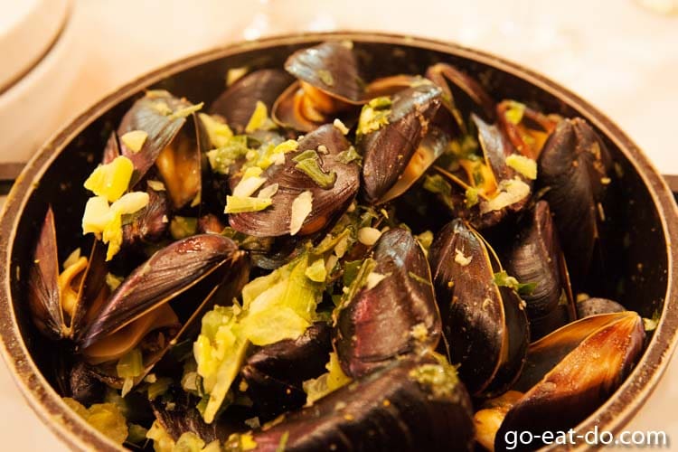 Pot of steamed mussels, a traditional Belgian delicacy, served at the Chez Leon restaurant in Brussels, Belgium