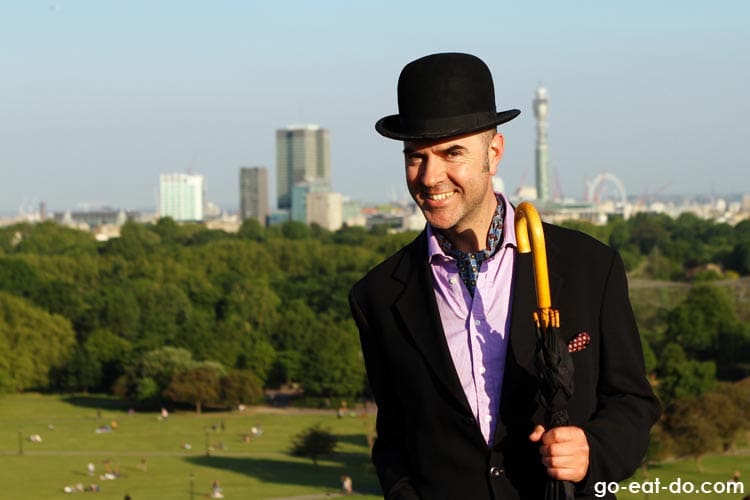 Julian McDonnell of Joolz Guides wearing a top hat in London.