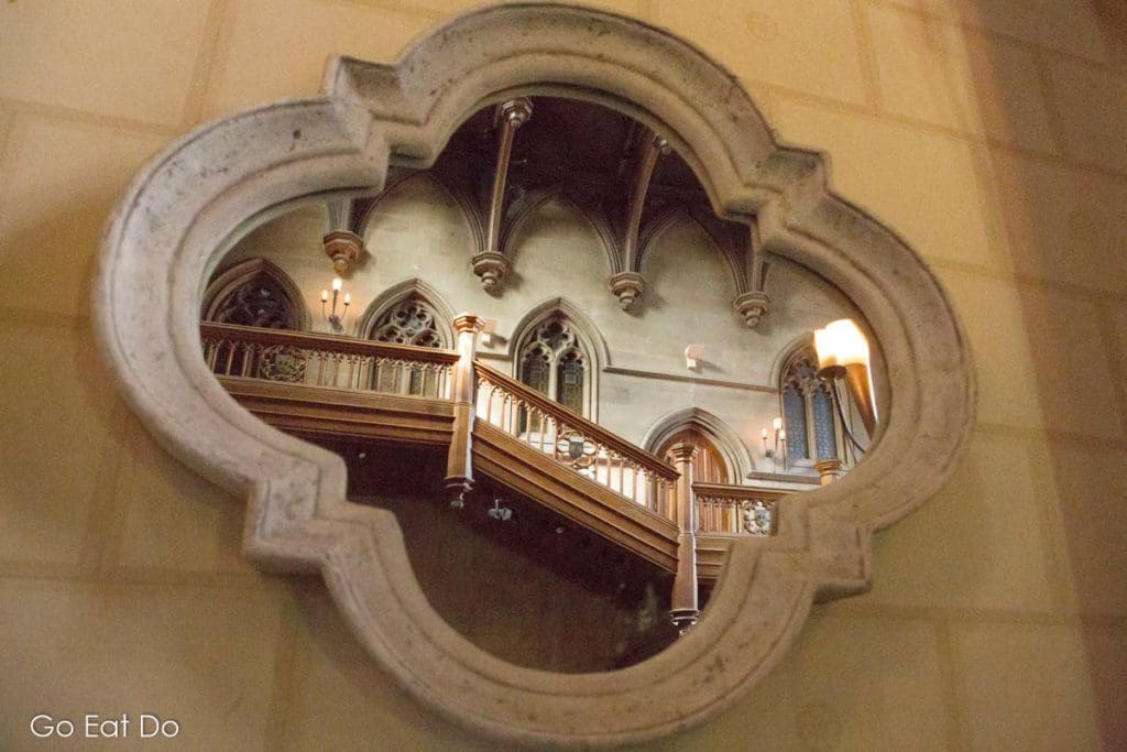 The great hall seen reflecting in a mirror