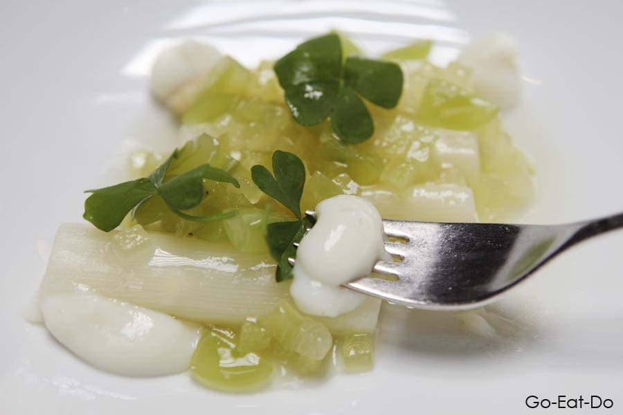 Cookies? This shows white asparagus served with melon, grapes, elderflower and buttermilk cream.