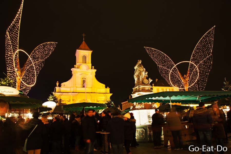 Stalls illuminated at night at the Baroque Christmas Market in Ludwigsburg, Germany