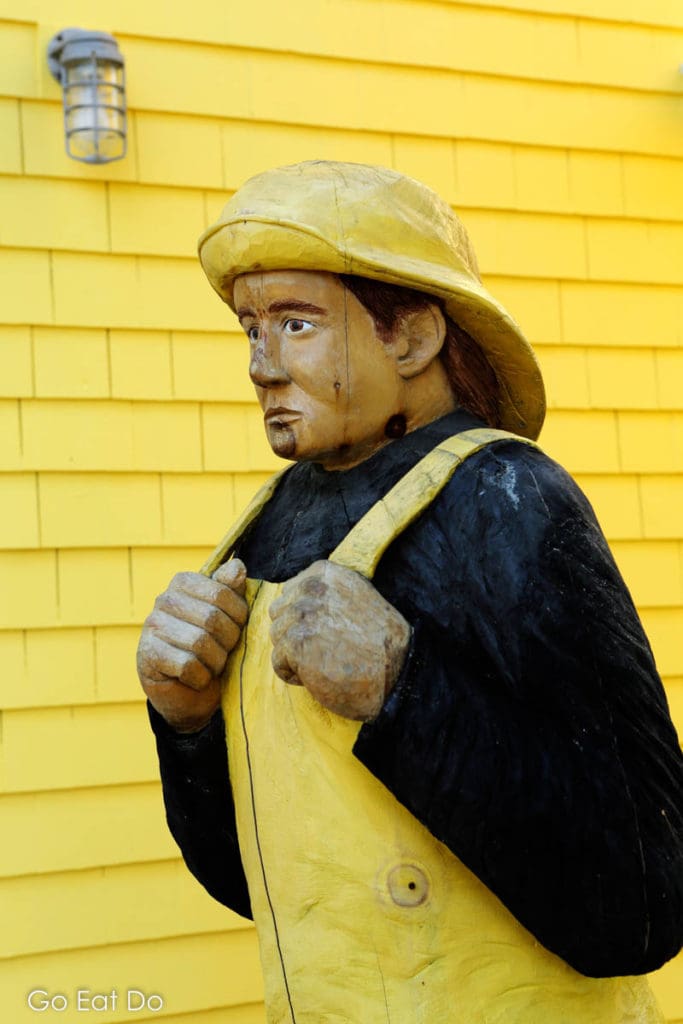 A fisherman figure in Mahone Bay reflects the maritime heritage of Nova Scotia's South Shore.