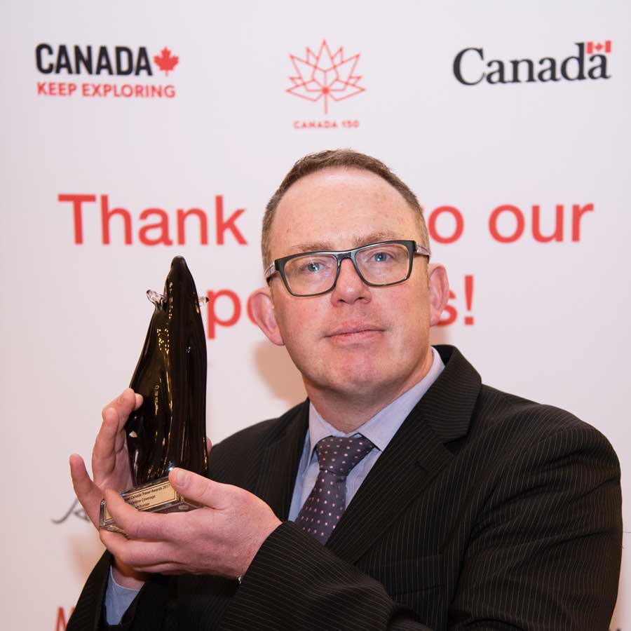 Stuart Forster with the glass polar bear British Annual Canada Travel Award (BACTA) trophy for Best Online Content