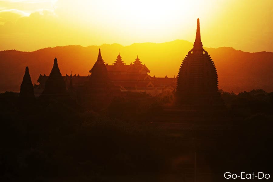 Buddhist temples semi-silhouetted during the sunset in Bagan, Myanmar