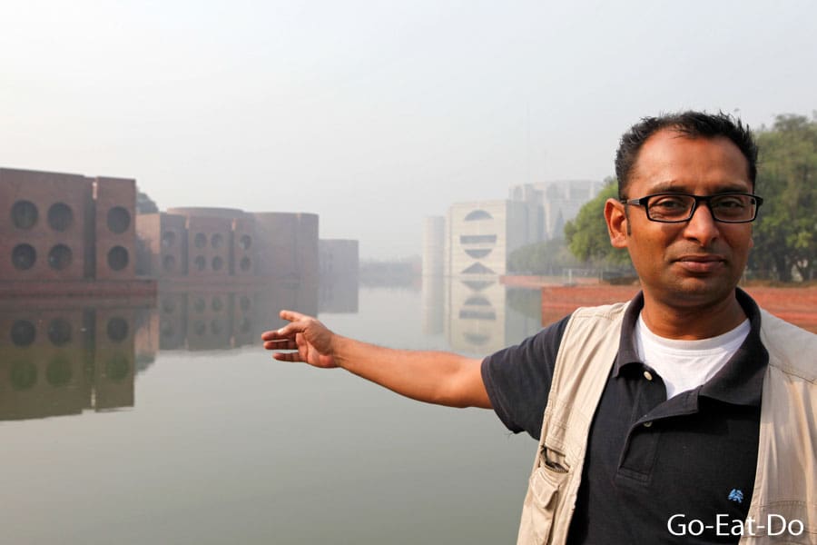 Tour guide Zia Ahmed at the Jatiya Sangsad, the parliament building designed by Louis Kahn in Dhaka, Bangladesh