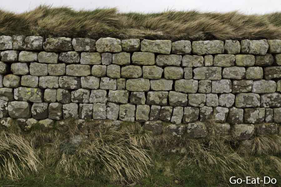 Blocks of stone hewn in Roman times on Hadrian's Wall above Crag Lough in Northumberland, England