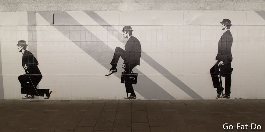 Street art depicting John Cleese doing the silly walk in Monty Python's Flying Circus at the Silly Walk Eindhoven in the Netherlands