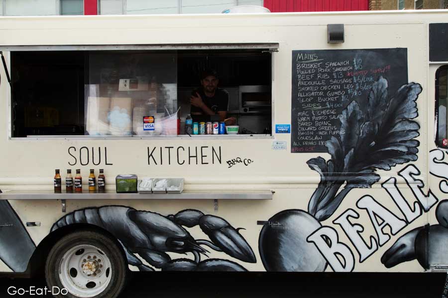 Soul Kitchen food truck serving smoked meat at the Lilac Festival on 4th Street in Calgary, Alberta, Canada