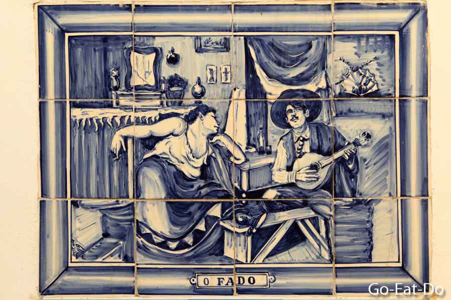 Azulejo tiles show Jose Malhoa's famous painting O Fado in Sintra, Portugal