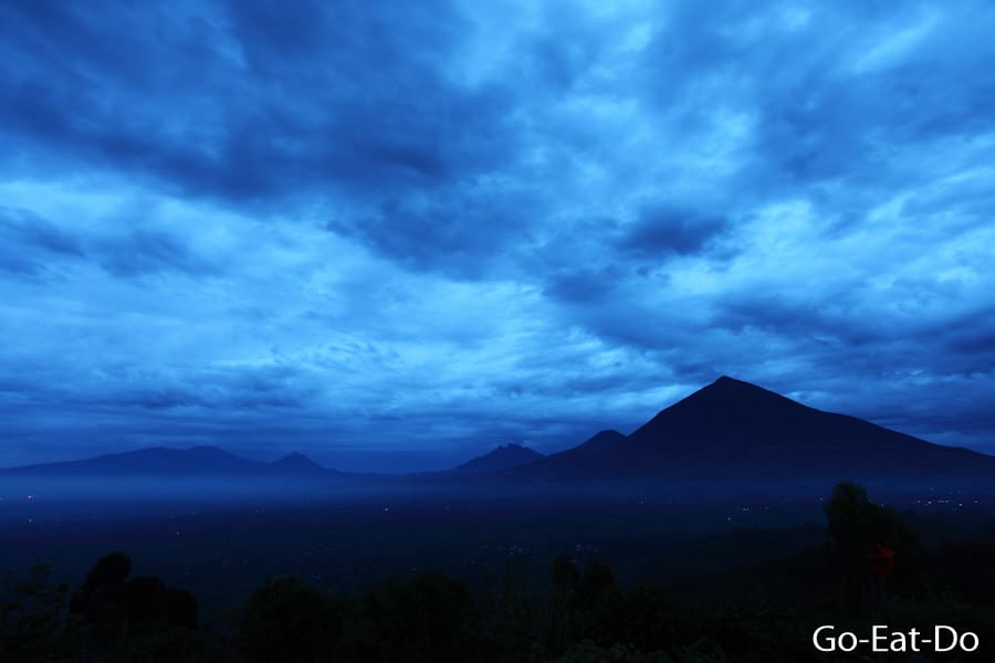 Overcast pre-dawn sky above mountains in the Virunga Mountain Range, the location of Volcanoes National Park, in Rwanda