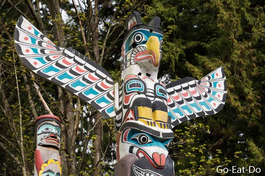 First Nations artwork on a thunderbird house post, one of the totem poles at Brockton Point in Stanley Park, Vancouver, BC, Canada